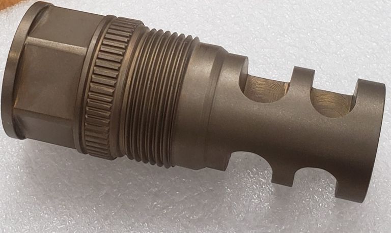 Bore lock adaptor and integral muzzle brake